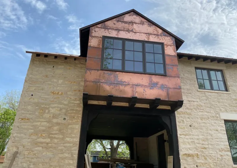 Copper metal panel facade on a stone building for Skylight Installation in Wilmington